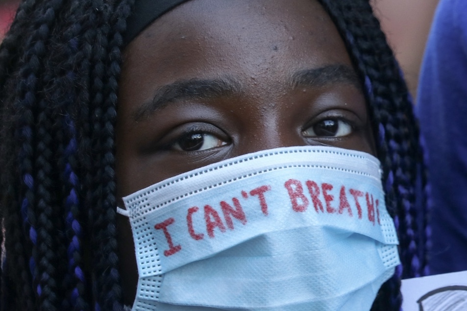 A person wearing a surgical mask with “I can’t breathe” written on it marches in a Black Lives Matter rally in Ottawa, Ont., on June 5, 2020. Tens of thousands took to the streets of downtown Ottawa to protest police brutality and anti-Black racism.