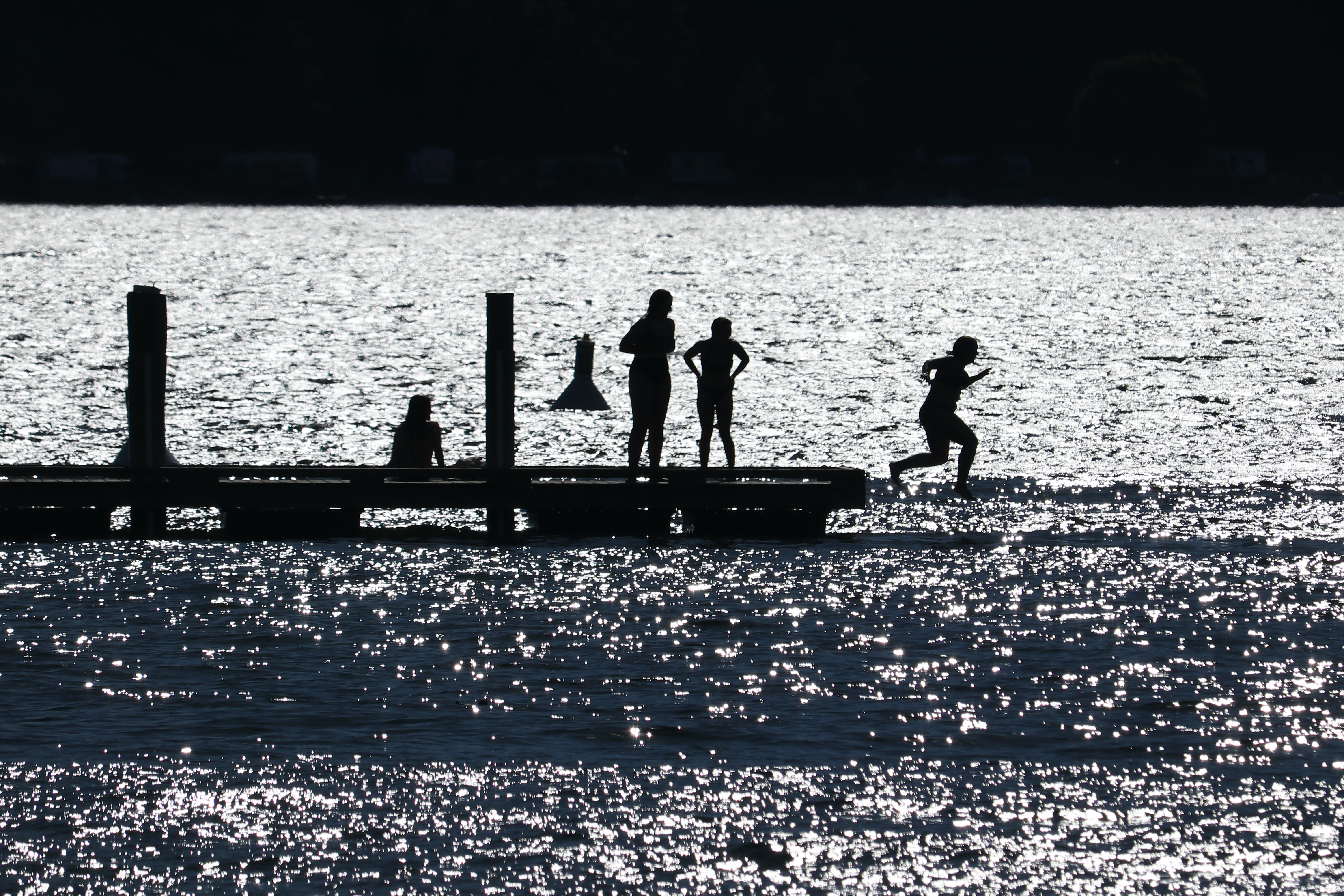 People go for a swim in Okanagan Lake in Kelowna, B.C., on June 22, 2021. (Photo by Aaron Hemens for Kelowna Capital News)