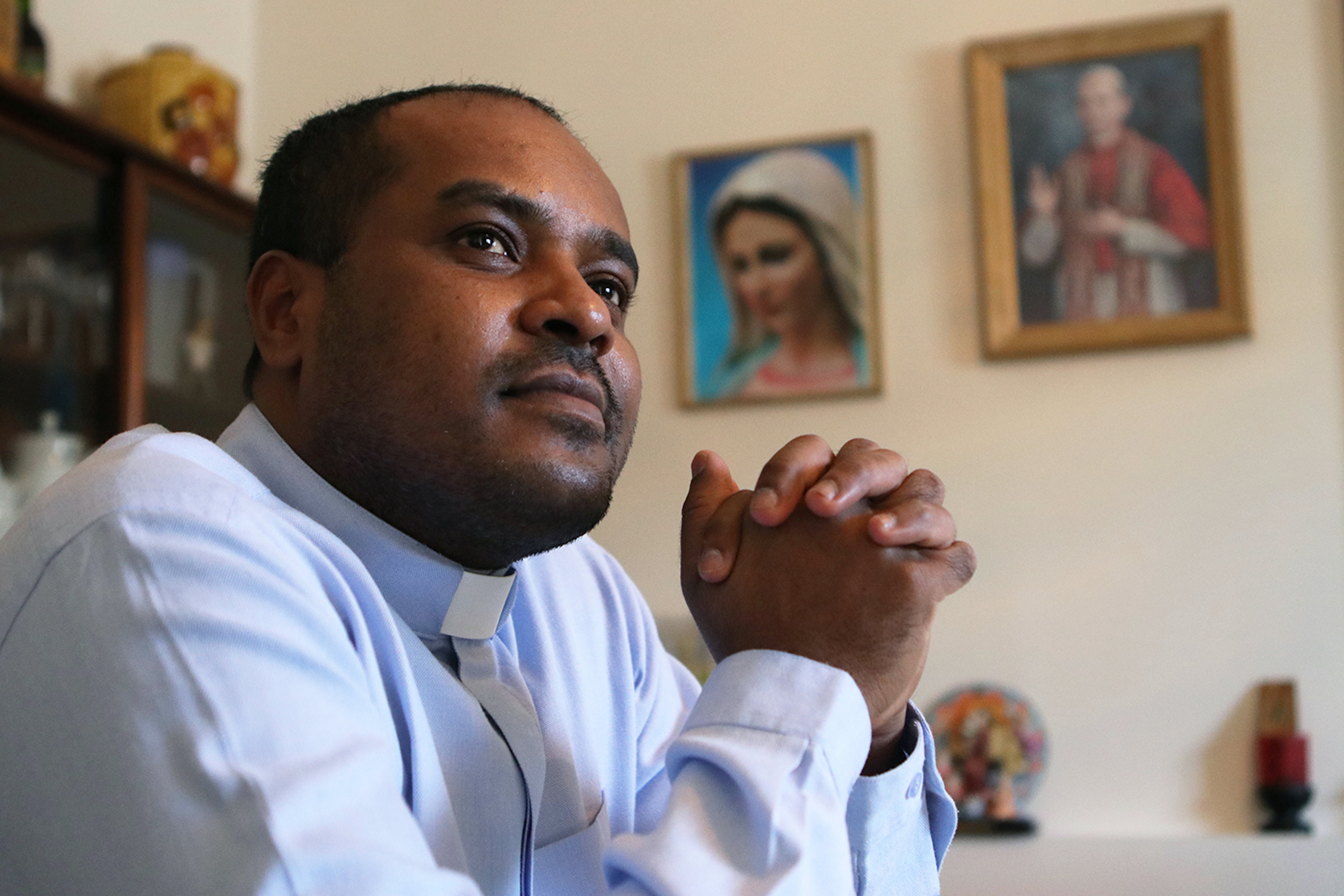 Father Kanickaisamy Lawrence, the priest of CrestonÕs Holy Cross Catholic Church, poses for a portrait in the living room of the churchÕs rectory in Creston, B.C., on Feb. 5, 2021. (Photo by Aaron Hemens for Creston Valley Advance)