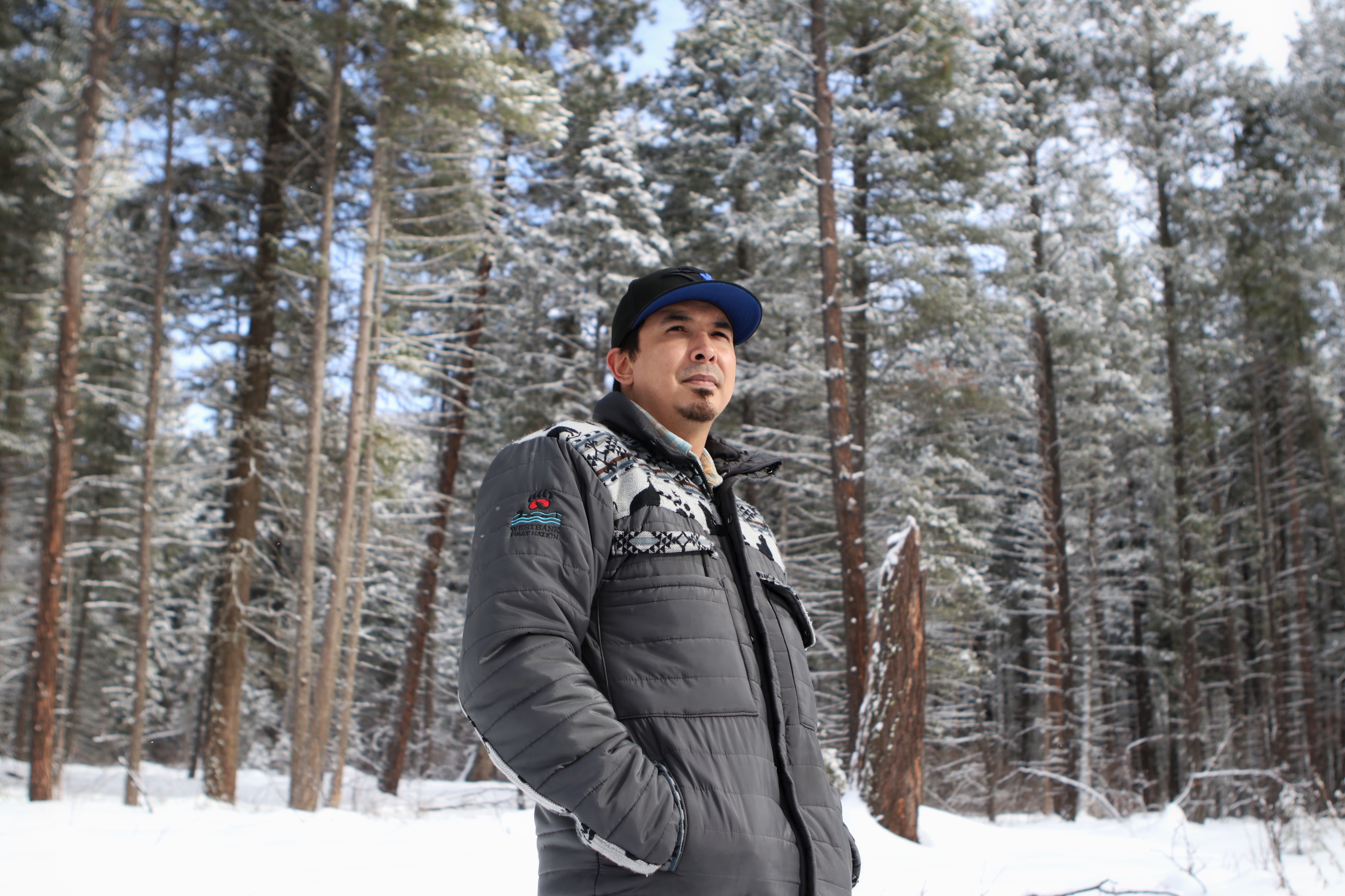 Westbank First Nation councillor and Ntityix Resources LP president Jordan Coble stands in an area of the Westbank First Nation Community forest in Peachland, B.C., on Feb. 3, 2022. (Photo by Aaron Hemens for the Discourse)